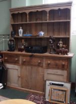 A large rustic pine dresser, 170cm x 44cm x 205cm