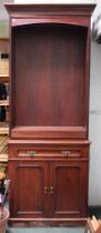 A part 19th century mahogany bookcase on cupboard base with shelves above