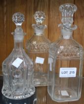 Three cut glass decanters