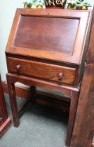 An early 20th century oak drop down bureau