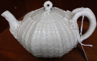 A "Belleek" ceramic teapot, sea urchin form with coral moulded handle and spout, black backstamp