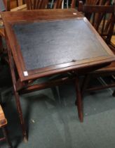 A 19th century mahogany sloping scribes desk on x-frame support with skiver inset