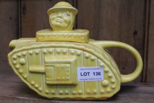 A "Sadler" pottery teapot modelled as a First World War tank, with "Old Bill" type character lid kno