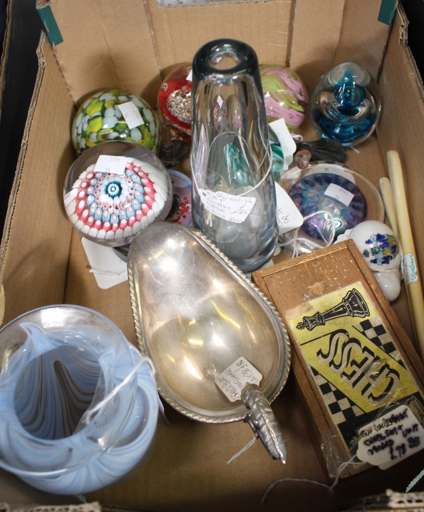 A small tray box containing a selection of glass paperweights, embossed chess set, etc