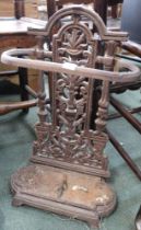 A 19th century cast iron stick/umbrella stand of small proportions with original drip tray