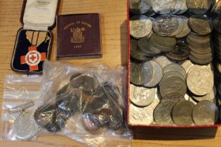 A British Red Cross medal, a Defence medal, Crowns & old copper coins in an OXO tin