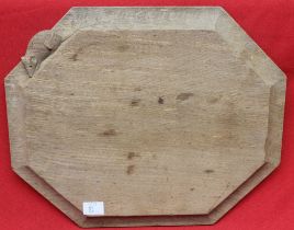 A Robert Thompson of Kilburn (1876-1955) "Mouseman" carved wood breadboard, of canted form with sign