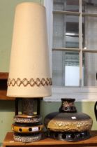 A mid-century ceramic table lamp base with shade together with a similar example