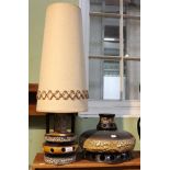 A mid-century ceramic table lamp base with shade together with a similar example