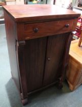An early 20th century mahogany cabinet of single drawer over automatic opening double doors