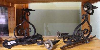 A pair of wrought iron craftsman made corner electric light fittings for restoration