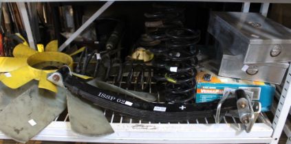 A shelf of miscellaneous car parts and accessories