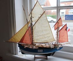 A wooden model sailing ship