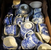 A tray box containing a selection of vintage blue and white china