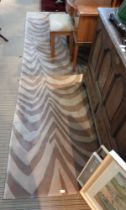 A large modern brown and beige ground stripe effect floor rug, 278 x 365 cm