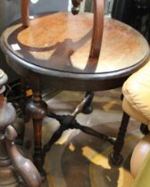 A circular low oak occasional table