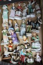 Two Hummell ceramic figurines and a collection of European ceramic figures, includes Capo di Monti