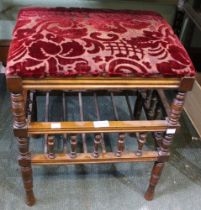 A mahogany pad topped music stool with under tier gallery