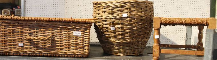 A wicker picnic basket with a woven top stool and another basket