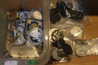 A bag containing old copper coins, commemorative, crowns, badges, tokens & a couple of medals