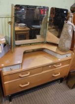 A mid-century E.Gomme G-Plan light oak dressing table with triple mirror
