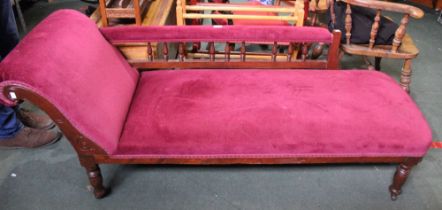 A maroon upholstered 19th century chaise long