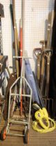 A wide selection of garden tools including an electric hedge trimmer, forks, rake etc