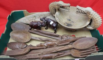 A collection of carved wood Tribal items, includes a protective, Opal Eye Fetish mask, a bowl with c