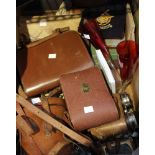A tray box containing binoculars, Victorian photos and other collectible items