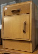 A mid century G-Plan bedside cupboard single drawer light oak