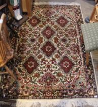 A floor rug, cream ground with fringe, 190cm x 135cm