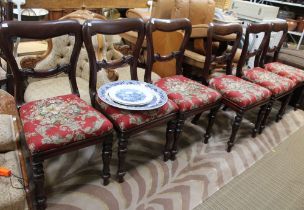 A set of six Victorian mahogany chairs, red floral upholstery