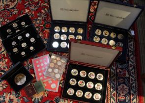 Three year sets of coins, some enameled sets of coins, together with boxes of commemorative coins &