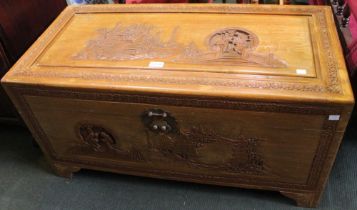 A 20th century Oriental camphor wood carved trunk