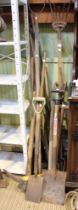 A collection of vintage wooden shafted mainly garden hand tools