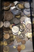 An old tin containing badges, old copper coins & Roman medallions, etc