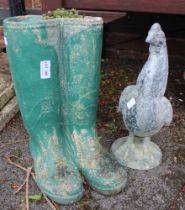 A cast garden planter in the form of wellies together with a chicken ornament