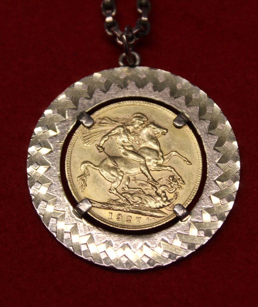 A 1927 full sovereign set into a 9ct gold pendant mount, suspended from a 9ct gold chain, gross weig - Image 2 of 3