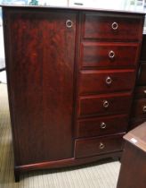 A Stag dark wood single low wardrobe with drawers to side