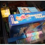 A box containing a wide selection of games and puzzles