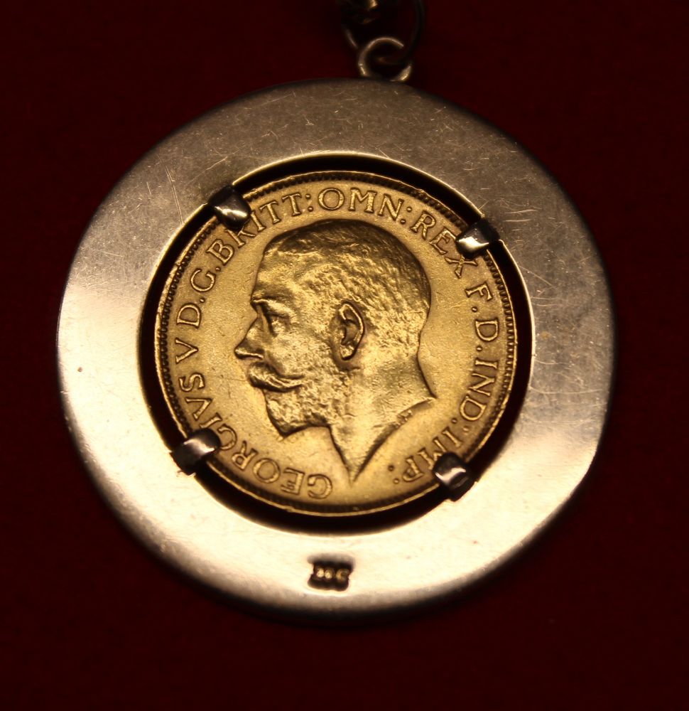 A 1927 full sovereign set into a 9ct gold pendant mount, suspended from a 9ct gold chain, gross weig - Image 3 of 3