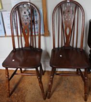 A set of four wheel back chairs