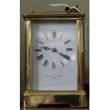 A Mappin and Webb London, a brass cased chiming carriage clock, white enamel dial with Roman Numeral