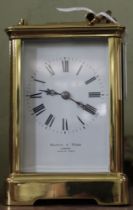 A Mappin and Webb London, a brass cased chiming carriage clock, white enamel dial with Roman Numeral