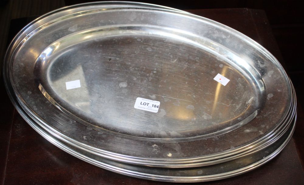 Eight oval stainless steel platters
