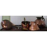 Two large copper jugs, a copper and brass coal scuttle, two bed warmers and a shovel