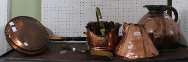 Two large copper jugs, a copper and brass coal scuttle, two bed warmers and a shovel