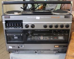 A portable Hitachi stereo player / recorder with lead
