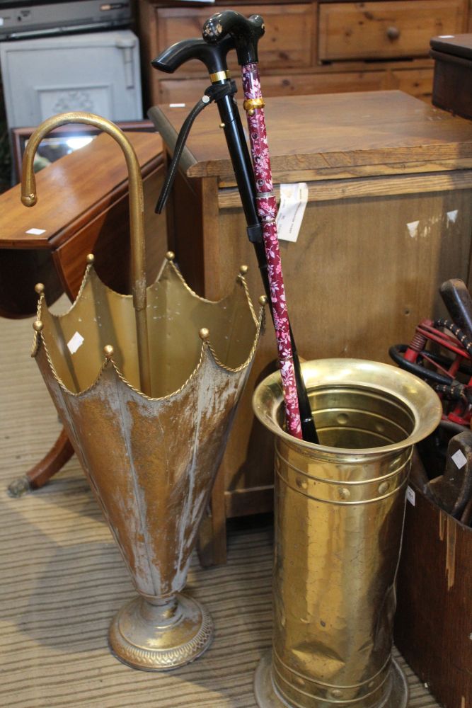 Two metal stick stands one shaped as an umbrella