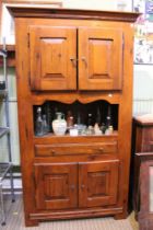 A substantial larder cupboard with two sets of double doored shelf units single drawer and open shel